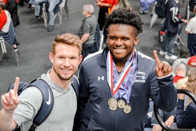 Athlete celebrating with two gold medals